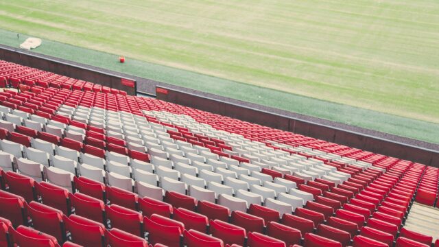 Empty Stadium Red and White Seating Pattern 4K Wallpaper
