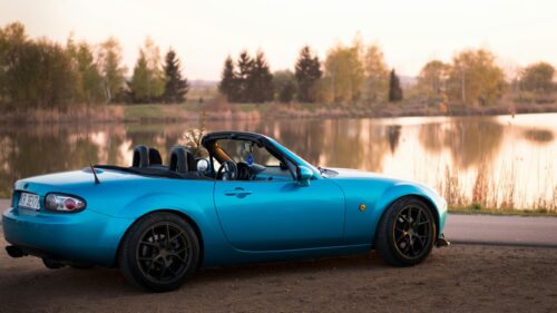 Stunning Blue Mazda MX-5 Miata at Sunset Lake Desktop Wallpaper