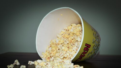Spilled Popcorn in Yellow Bucket 4K Desktop Wallpaper