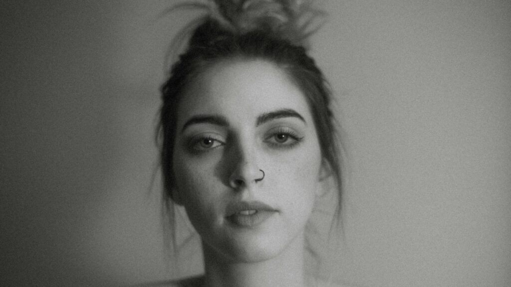 Moody Portrait of a Young Woman with Nose Ring 4K Desktop Wallpaper
