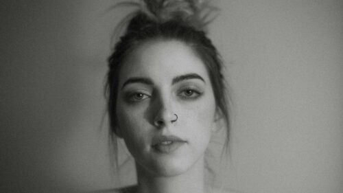 Moody Portrait of a Young Woman with Nose Ring 4K Desktop Wallpaper