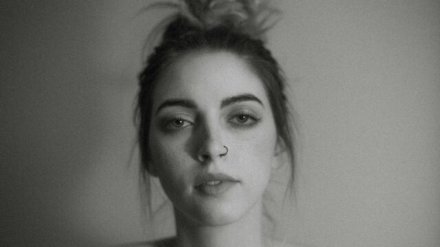 Moody Portrait of a Young Woman with Nose Ring 4K Desktop Wallpaper