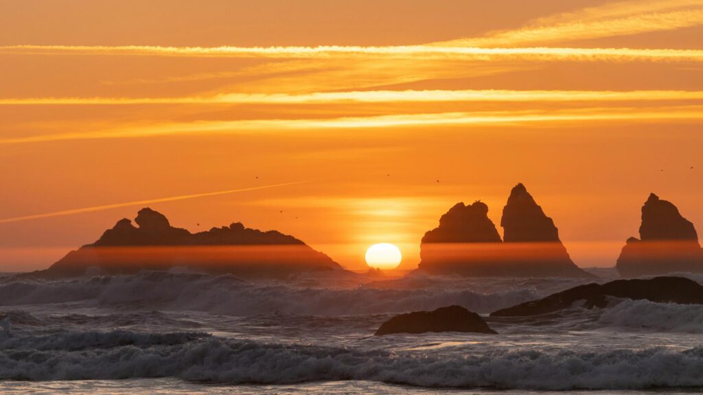 Golden Sunset Over Rugged Sea Stacks Coastal Scenery 4K Wallpaper