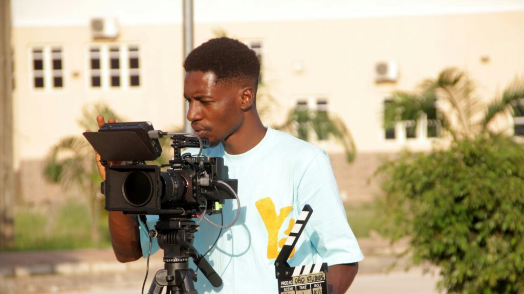 Cinematic Filmmaker with Professional Camera Crew Desktop Wallpaper