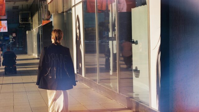 Stylish Person Walking in Urban City Street Desktop Wallpaper