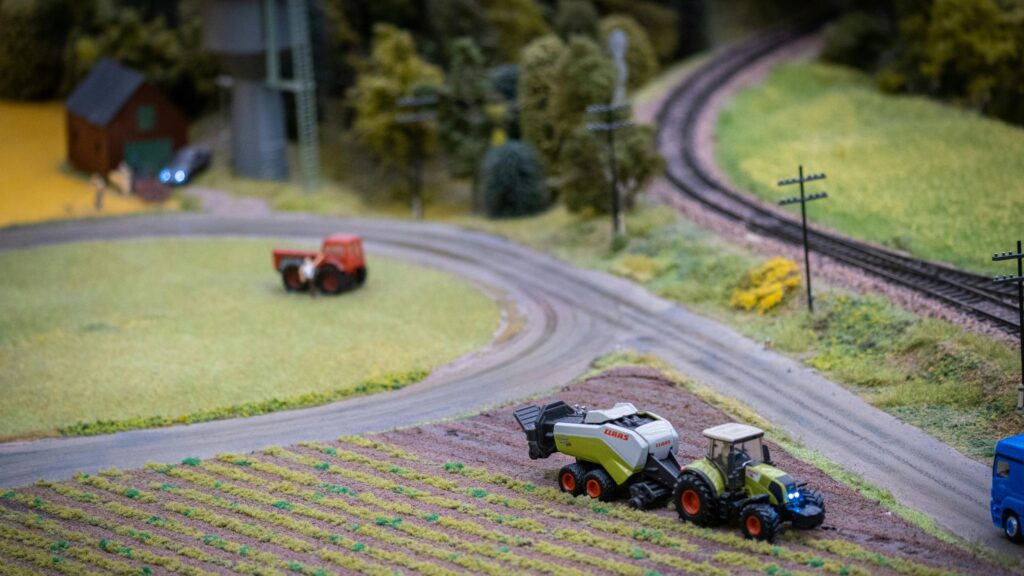 Miniature Farm Diorama with Claas Tractor and Rural Landscape Desktop Wallpaper