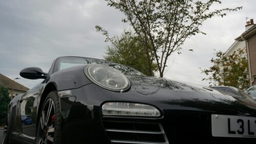 Low Angle Black Porsche 911 Convertible 4K Desktop Wallpaper
