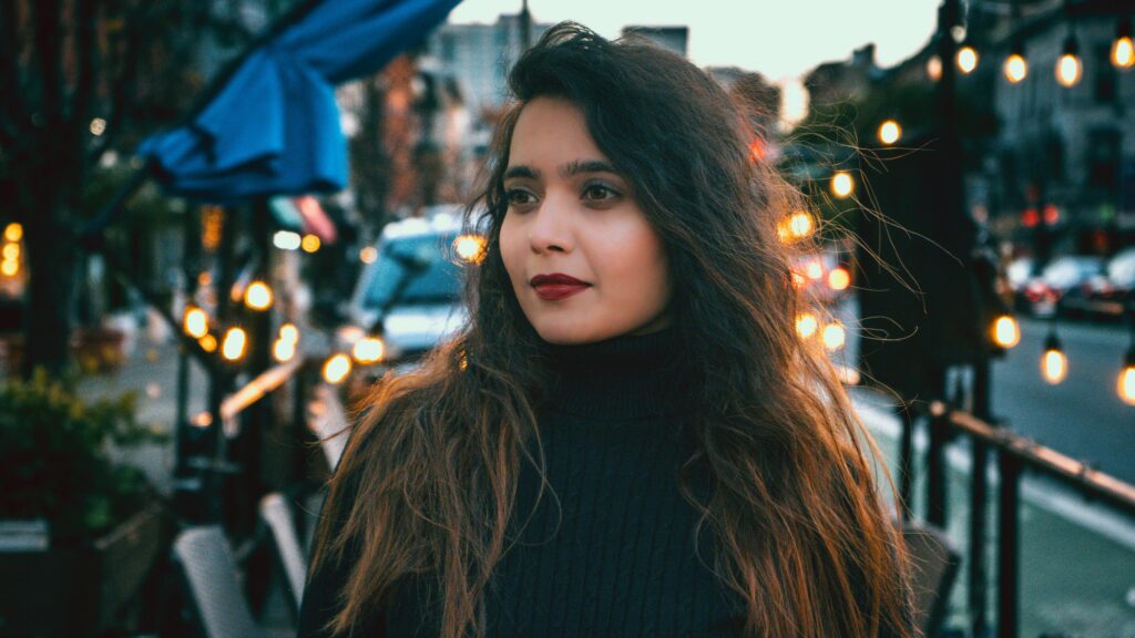 Beautiful Woman with Long Dark Hair at Sunset City Lights 4K Wallpaper