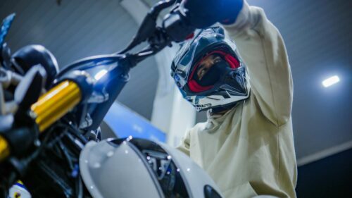 Biker in Helmet on Sportbike at Gas Station 4K Desktop Wallpaper