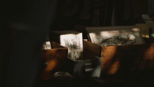 Vintage Lithograph Prints in Wooden Crates Desktop Wallpaper