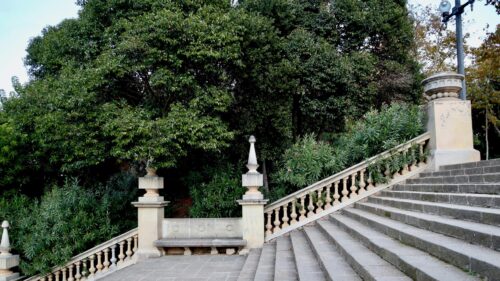 Elegant Stone Staircase in a Peaceful Mediterranean Garden Desktop Wallpaper
