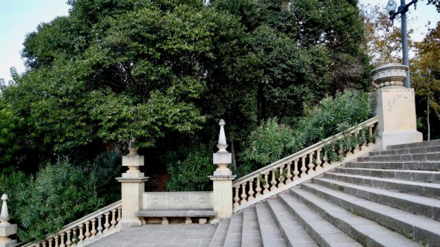 Elegant Stone Staircase in a Peaceful Mediterranean Garden Desktop Wallpaper