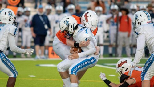 High-Action Football Tackle Intense Sports Scene Desktop Wallpaper