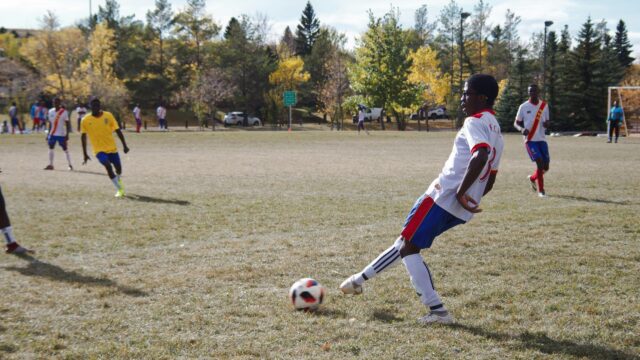 Intense Youth Soccer Match Action Shot Desktop Wallpaper