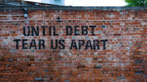 Until Debt Tear Us Apart Stencil Graffiti Red Brick Wall 4K Wallpaper