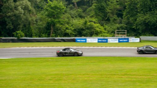 Grey Porsche Boxster and Sports Car Racing on Track Desktop Wallpaper