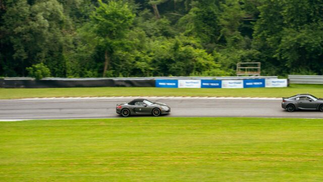 Grey Porsche Boxster and Sports Car Racing on Track Desktop Wallpaper