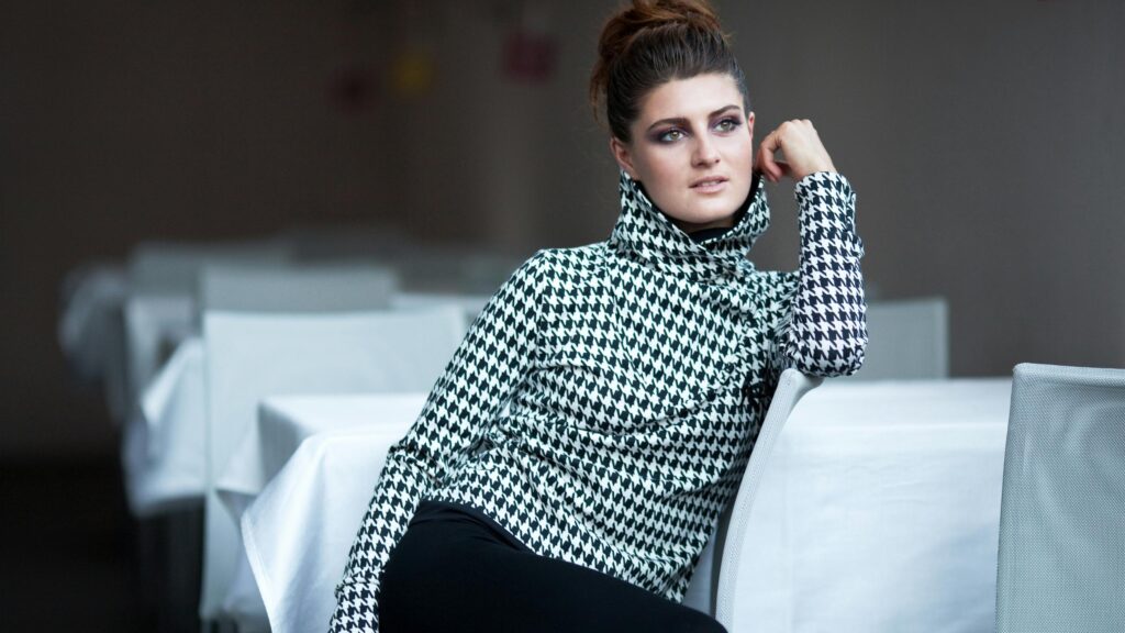 Elegant Woman in Houndstooth Turtleneck Fashion 4K Wallpaper