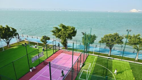 Coastal Sports Park with Vibrant Tennis Court and Soccer Field 4K Wallpaper