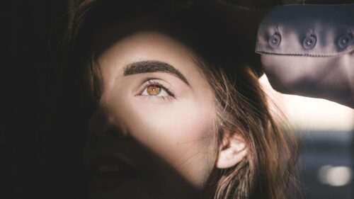 Stunning Close-Up Portrait of a Woman with Hazel Eyes 4K Wallpaper