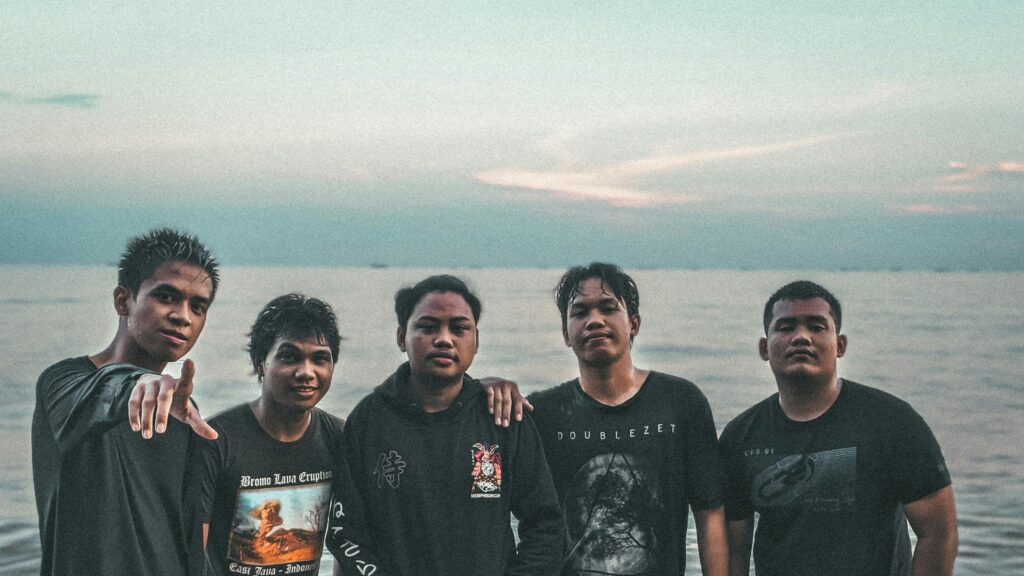 Group of Friends Posing at Beach Sunset 4K Desktop Wallpaper