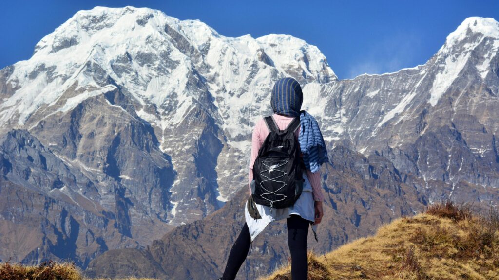 Hiker Overlooking Majestic Snowy Himalayan Mountains 4K Wallpaper