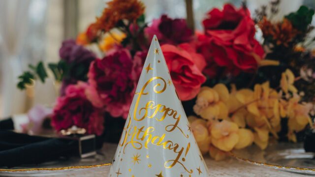 Elegant Happy Birthday Party Cone Hat with Floral Background 4K Wallpaper