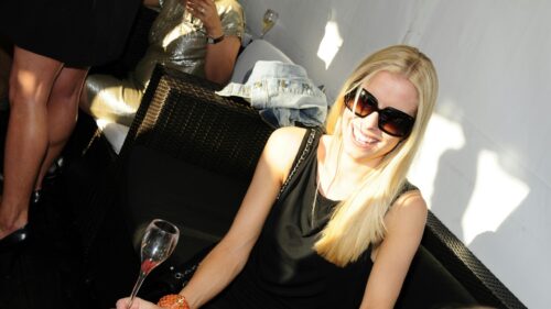 Blonde Woman Wearing Sunglasses at a Sunny Party Desktop Wallpaper