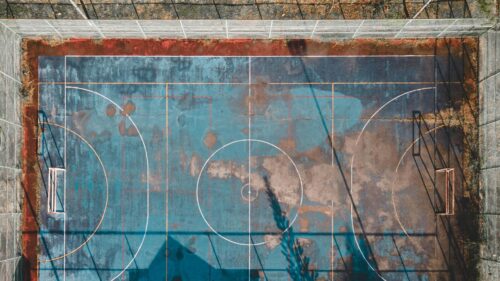 Aerial View of an Abandoned Blue Futsal Court Desktop Wallpaper