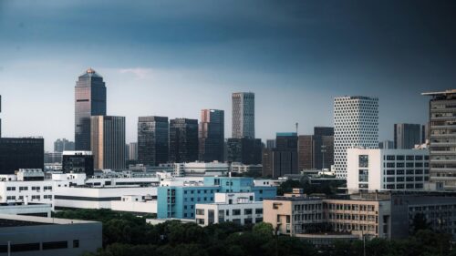 Modern City Skyline with Dramatic Stormy Sky Desktop Wallpaper