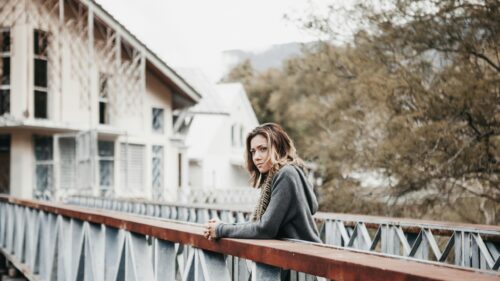Woman Leaning on Bridge Railing Soft Moody Portrait Desktop Wallpaper