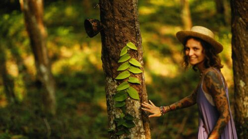 Woman Touching Tree in Tropical Forest 4K Desktop Wallpaper