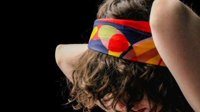 Curly Hairstyle with Colorful Geometric Headband Desktop Wallpaper