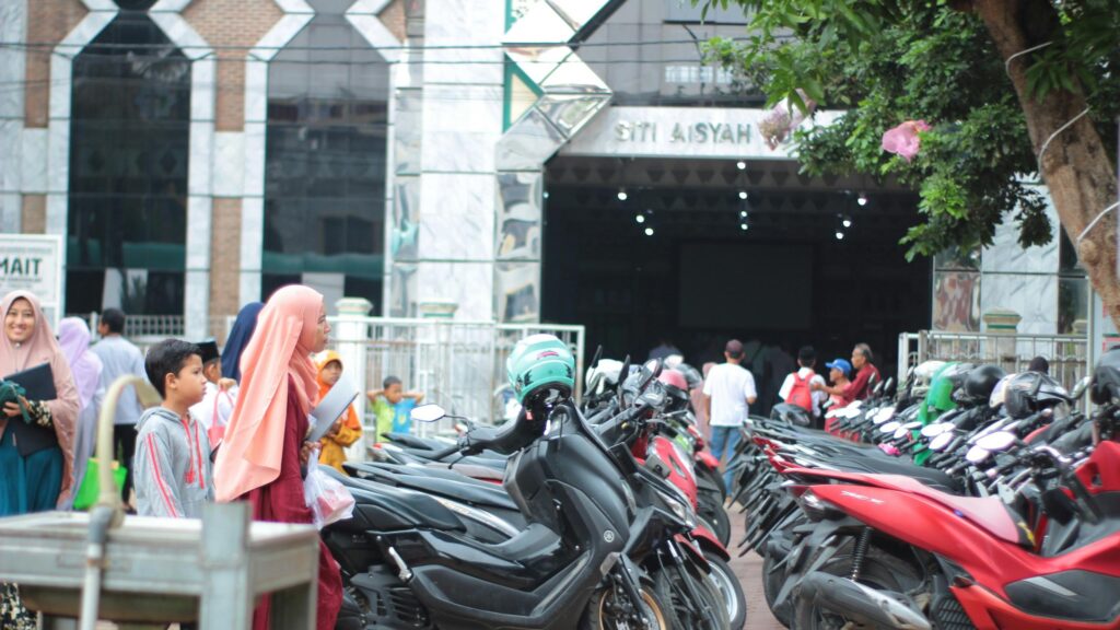 Busy Street Scene with Motorcycles at Siti Aisyah Mosque Desktop Wallpaper