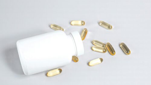 Minimalist White Supplement Bottle and Omega 3 Capsules 4K Wallpaper