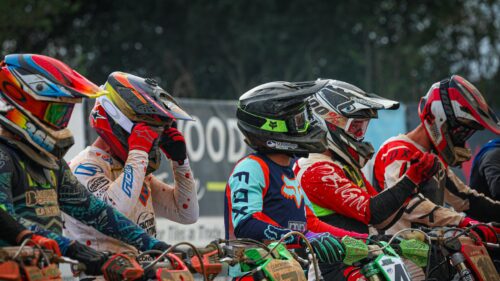 Motocross Racers Lining Up at the Starting Gate 4K Wallpaper