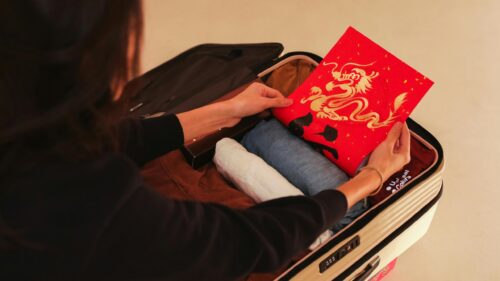 Woman Packing Lunar New Year Dragon Shirt for Travel Desktop Wallpaper