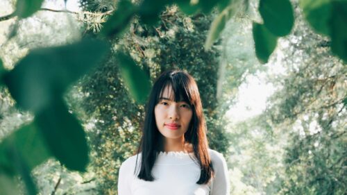 Asian Woman Portrait in Green Forest Nature Desktop Wallpaper
