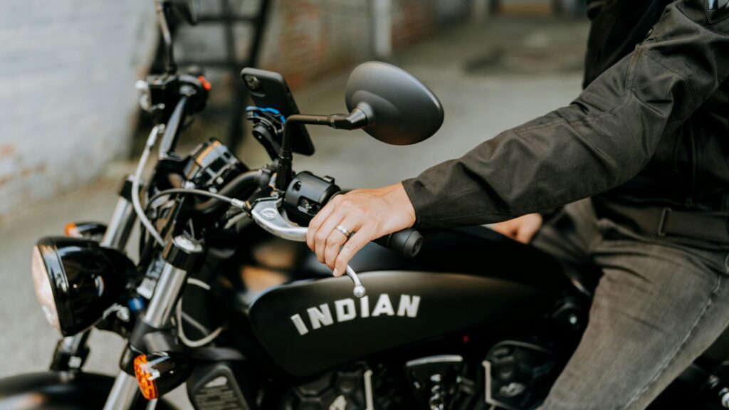 Close-up of Indian Motorcycle Rider Hand and Gas Tank Desktop Wallpaper