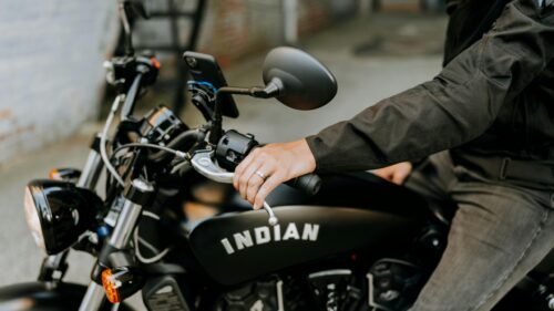 Close-up of Indian Motorcycle Rider Hand and Gas Tank Desktop Wallpaper