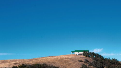 Minimalist House on Golden Hill Landscape 4K Desktop Wallpaper