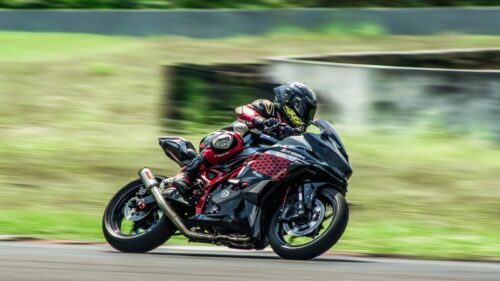 Kawasaki Ninja ZX-25R Sports Bike Racing on Track 4K Wallpaper