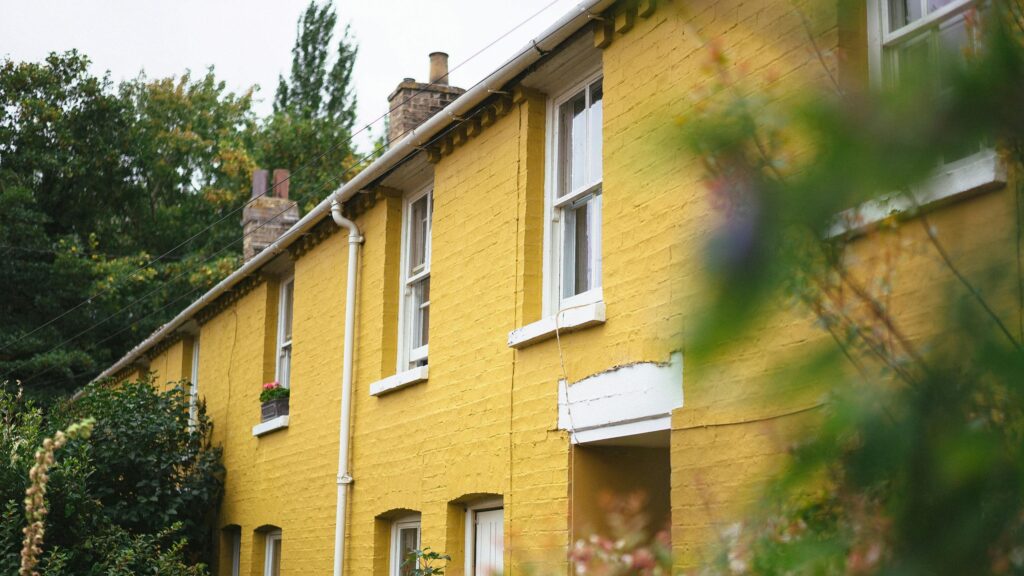 Charming Yellow Brick Cottage Home Exterior Desktop Wallpaper