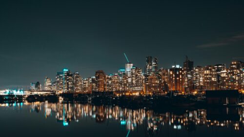 Stunning Vancouver City Skyline Reflection at Night 4K Wallpaper