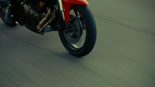 Red Sport Motorcycle Speeding on Asphalt Road Desktop Wallpaper