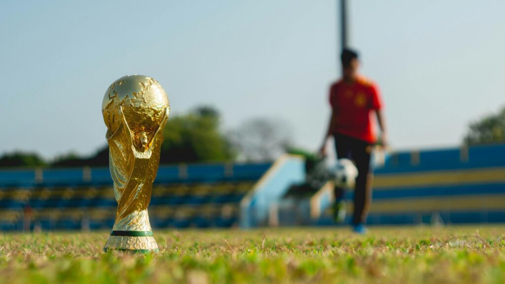 FIFA World Cup Trophy on Soccer Field 4K Wallpaper