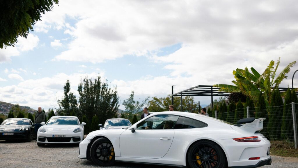 White Porsche 911 GT3 and Luxury Car Meetup 4K Desktop Wallpaper