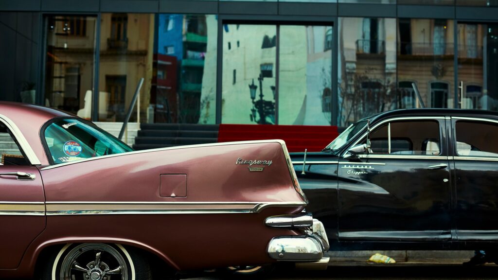 Vintage Pink Kingsway and Black Packard Luxury Cars Desktop Wallpaper
