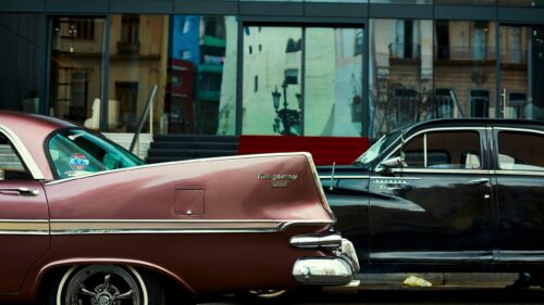 Vintage Pink Kingsway and Black Packard Luxury Cars Desktop Wallpaper