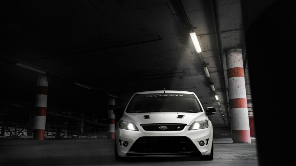 White Ford Focus ST Sports Car in Concrete Parking Garage Desktop Wallpaper